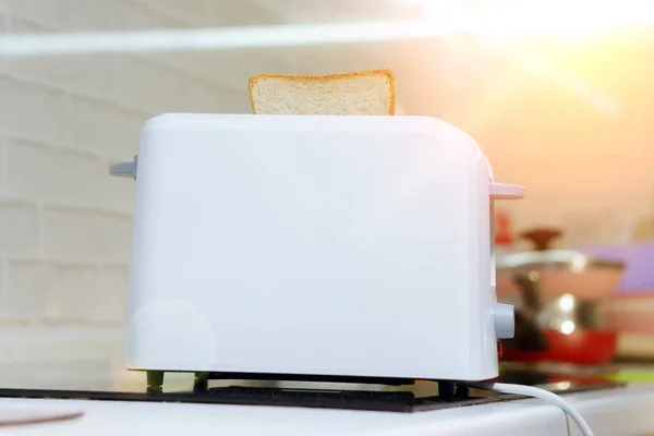 White Toast Bread In Two Slot Automatic Electric Toaster Making Toast For Breakfast Sliced Cooked Stock Photo White Toast Bread In Two Slot Automatic Electric Toaster Making Toast For Breakfast Sliced Cooked Stock Photo