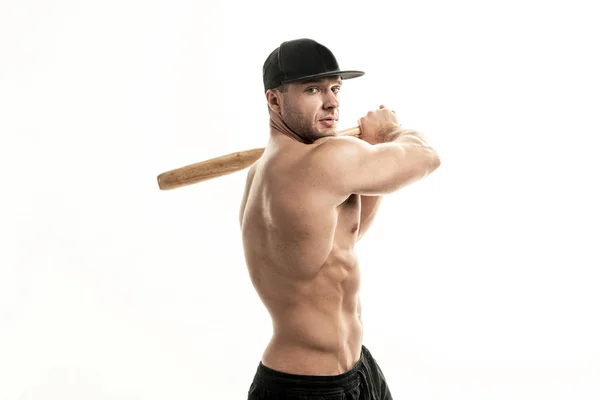 Close-up portrait of muscular man posing with a bat — Stock Photo, Image