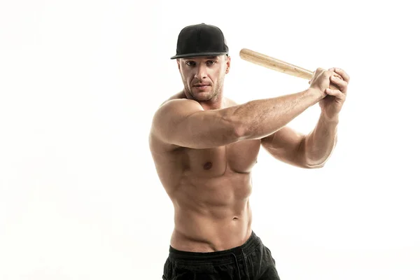 Close-up portrait of muscular man posing with a bat — Stock Photo, Image