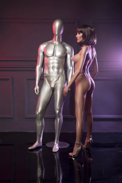 Mannequin with sexy naked woman — Stock Photo, Image