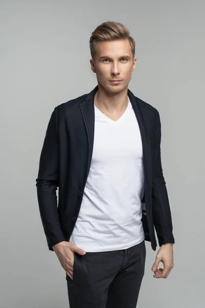 Elegant young male model in studio — Stock Photo, Image