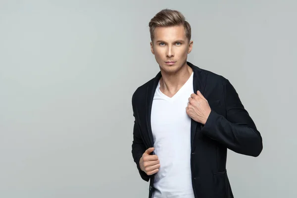 Elegant young male model in studio — Stock Photo, Image