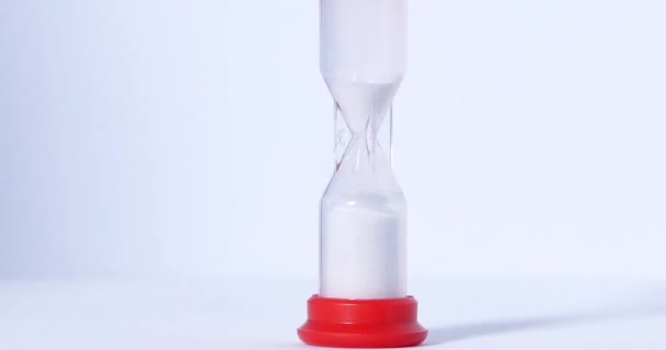 Hourglass close up on a white background. — 비디오