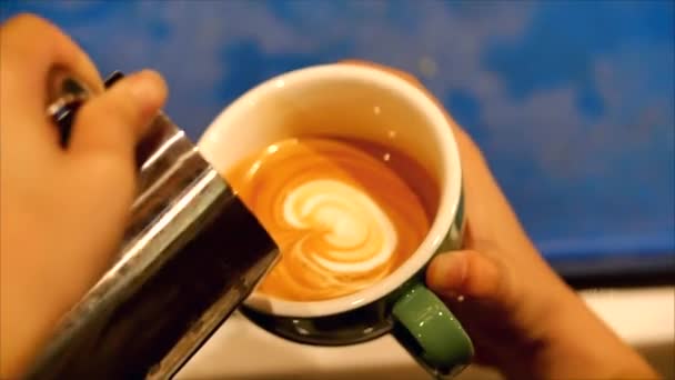 Making freshly ground coffee, Barista making Latte Art pouring milk into a mug while making a beautiful drawing, which makes the coffee even more desirable. Professional barista. — Αρχείο Βίντεο