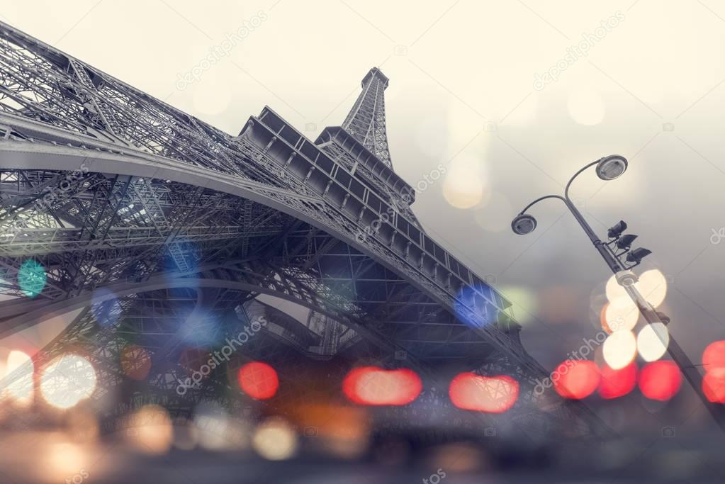 Eiffel tower and reflection of cars in Paris
