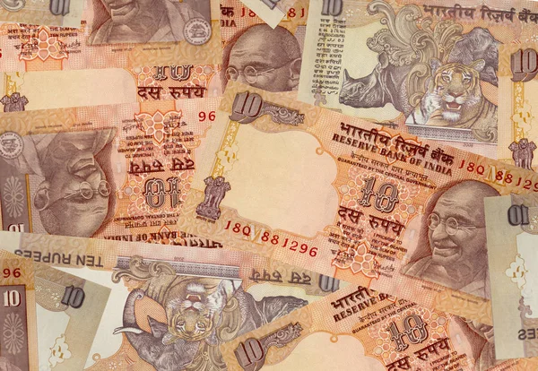 Patroon van Indiase geld, Mahatma Gandhi portret op het bankbiljet van 10 Indiase rupee — Stockfoto