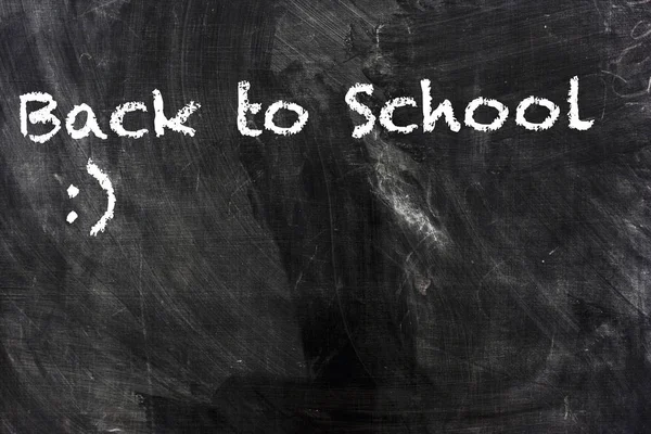 BACK TO SCHOOL text by chalk on blackboard — Stock Photo, Image