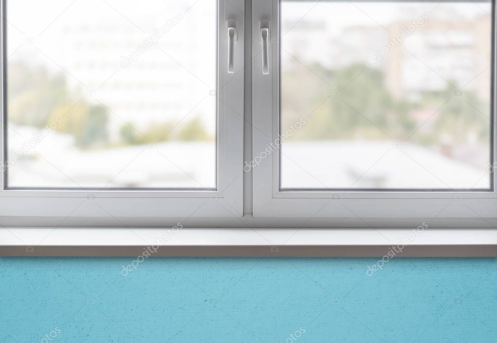 Close-up part of the clean white window and sill in a room