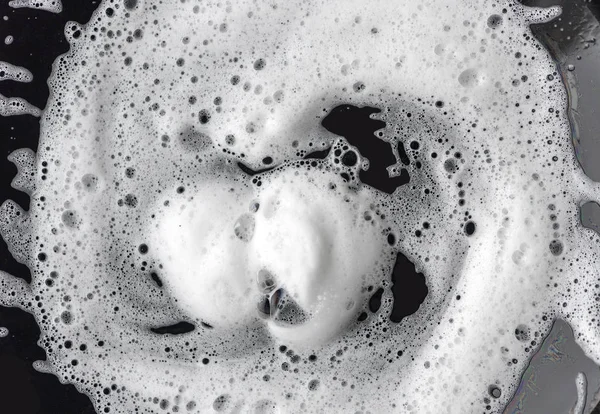 White soap foam on black plate, background or texture for ideas — Stock Photo, Image