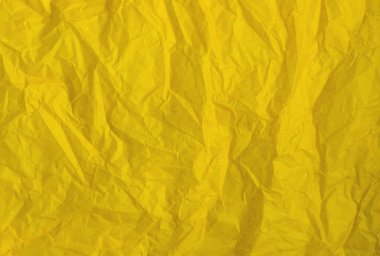 Arka plan veya doku olarak buruşuk sarı kağıt