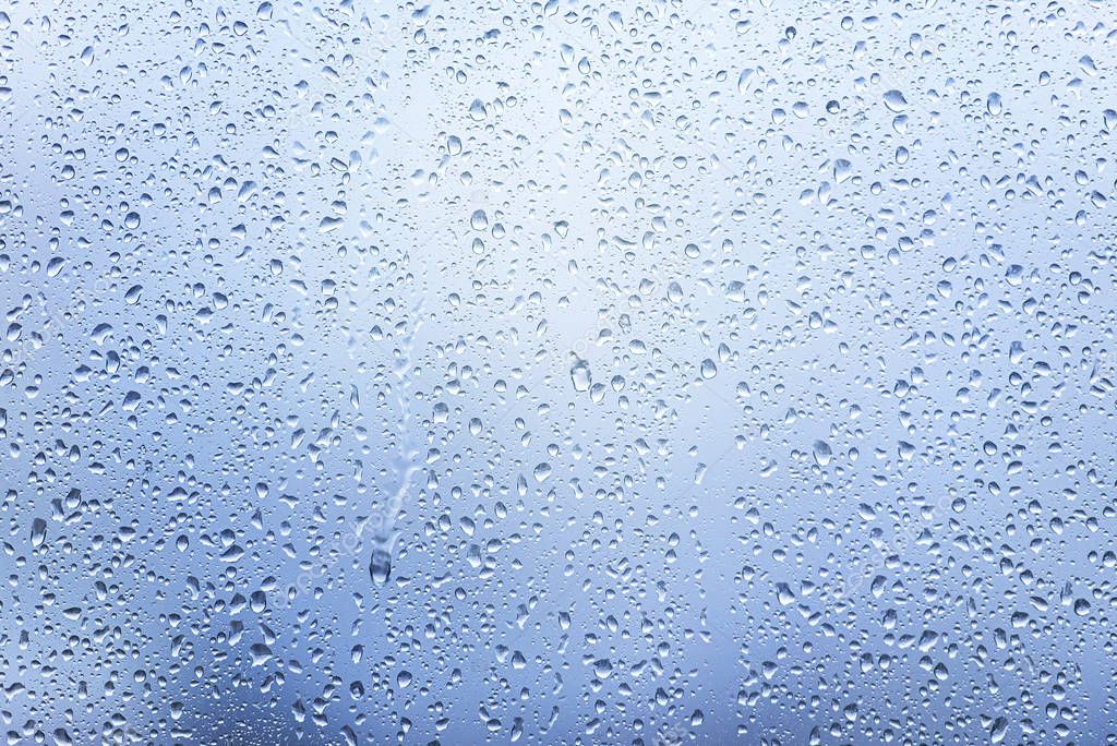 Window with Drops after heavy Rain, Water Drops on Glass as Background or Texture