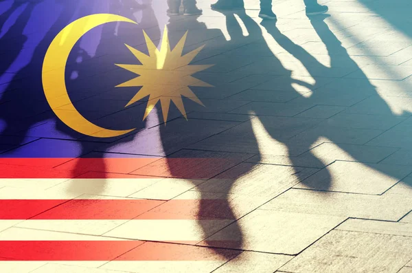 Malaysian Flag and Shadows of People, concept Picture