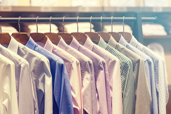 Men Shirts on Hanger, Row of colorful Shirts in Shopping Mall