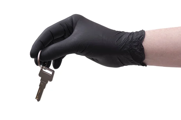 白い背景に隔離されたキーと黒の革の手袋で手 — ストック写真