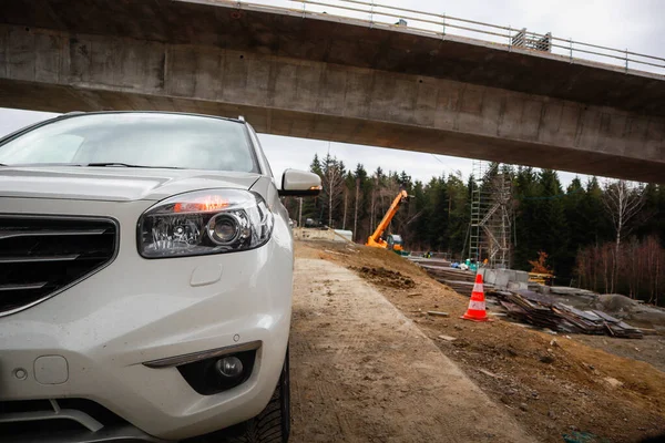 Road construction. Bridge. Installation work in Poland.White car.