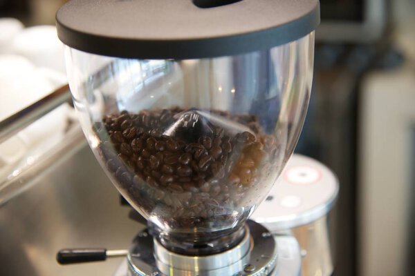 Close up coffee beans in machine 
