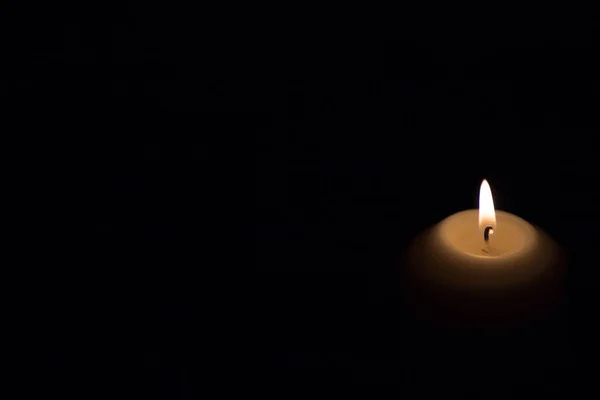 Candle flame on a dark background