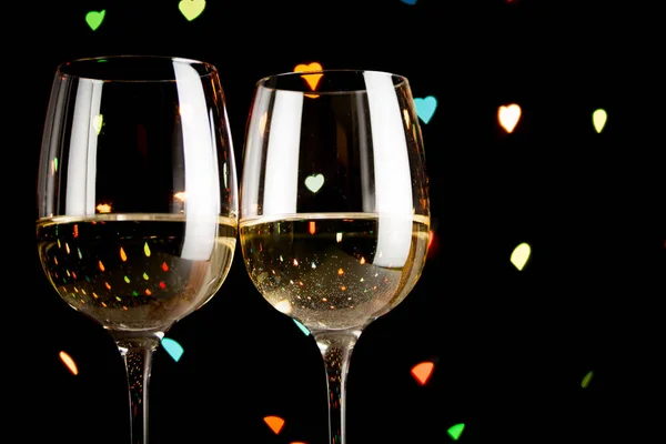 wine glass on hearts bokeh background