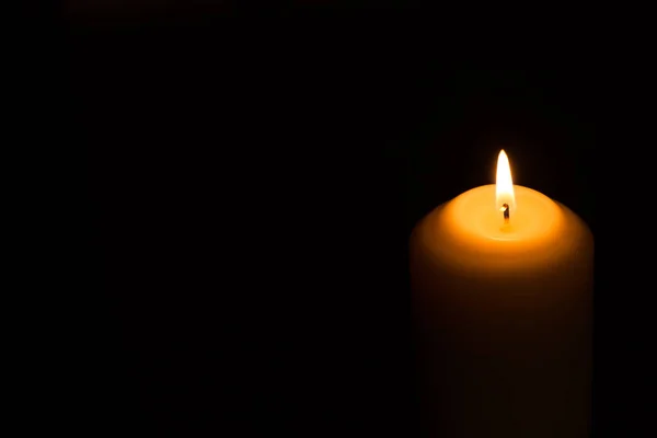 Candle flame on a dark background — Stock Photo, Image