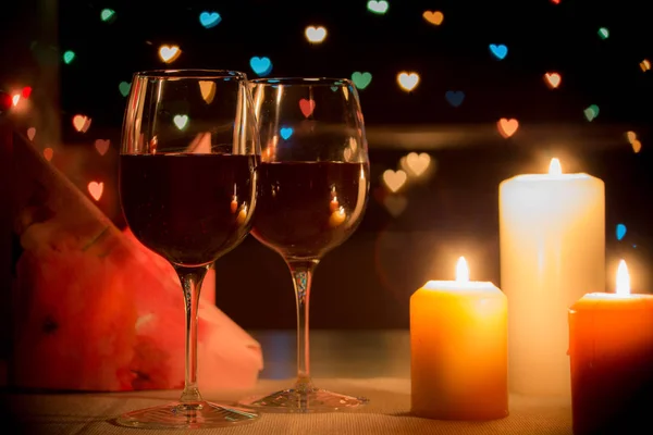 Wine glass on hearts bokeh background — Stock Photo, Image