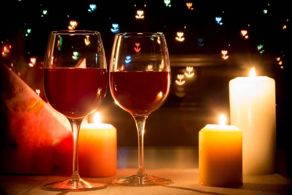 Wine glass on hearts bokeh background — Stock Photo, Image