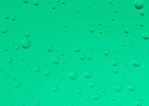 Water droplets on green glass — Stock Photo, Image
