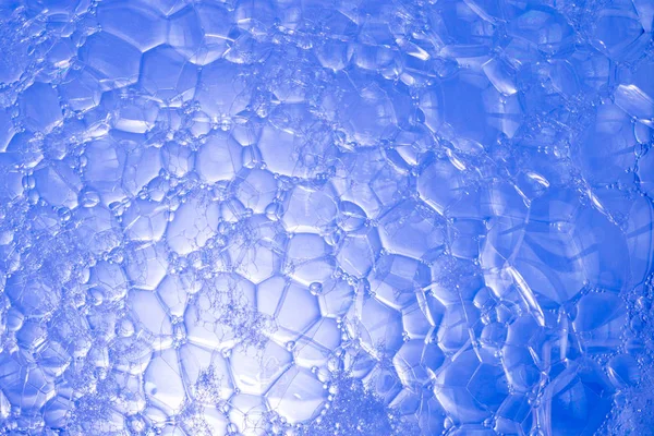 Blå bakgrund med såpbubblor — Stockfoto
