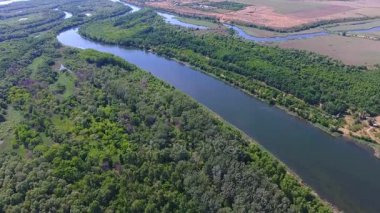 flight above forest and river at summer day. Rural landscape