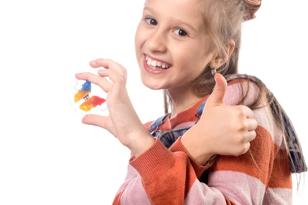 Little girl with orthodontics appliance isolated on white backgr — Stock Photo, Image