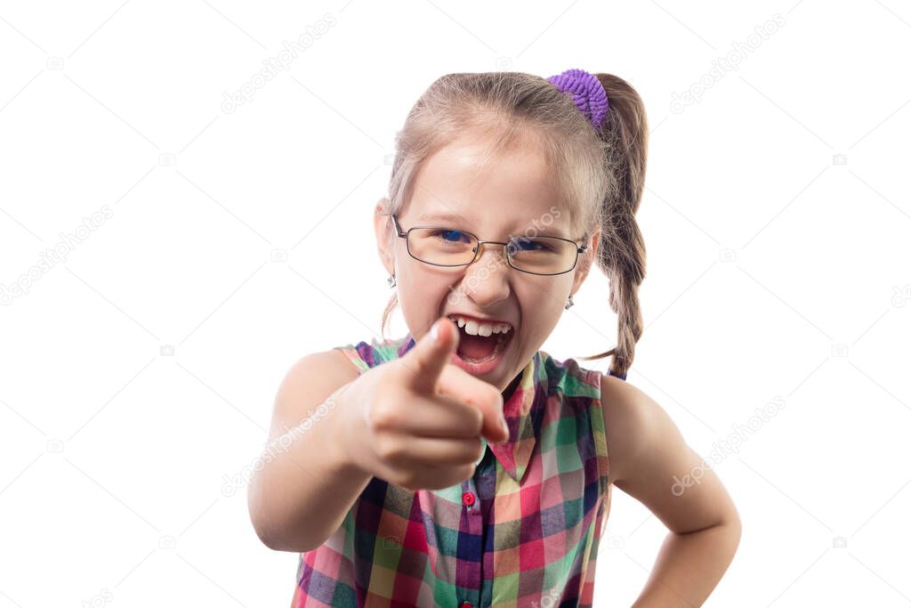 Little cute girl in glasses posing on a white background. Child with poor vision