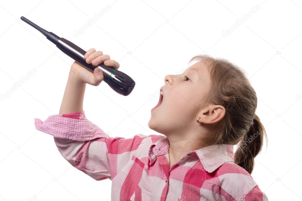 Little cute girl singing into a microphone isolated on a white background
