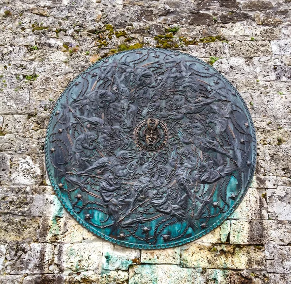 Wonderful Medieval Pattern on Circular Manhole Cover in old town, Gruyere, Fribourg, Switzerland, Europe