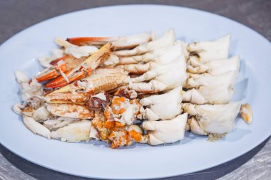 Steamed blue crab scabbard or paddle-leg meat from sea market. Fresh Tasty Appetizing Cooked Thai Asian Seafood Dish. Nutrition, Allergy, Aquatic food, Meal, Cuisine and Food Delivery Catering concept