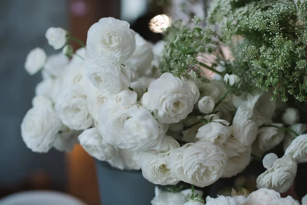 White floral composition of Ranunculus in the city flower market