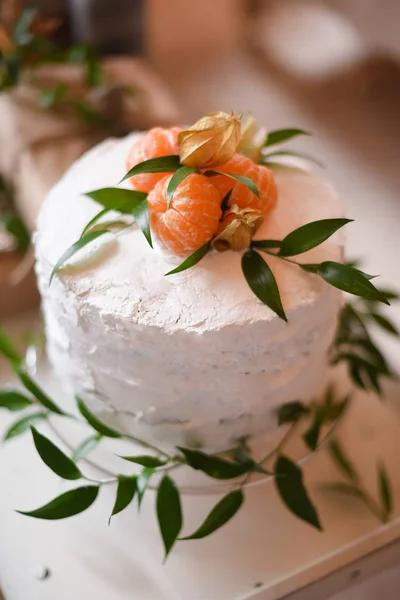 Gender reveal cake on baby shower party with box of mandarins