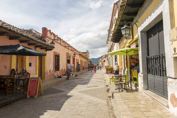 SAN CRISTOBAL, MEXICO - NOVEMBER 28: A colonial style street with side walk cafe's and unidentified people on November 28, 2016 in San Cristobal. San Cristobal de las Casas is a popular tourist destination known for its colonial architecture.