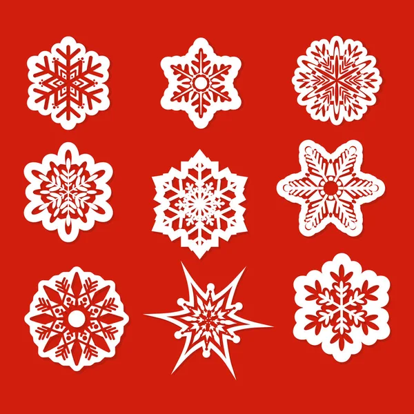 Векторна ілюстрація красивого набору сніжинок для різдвяного зимового дизайну в плоскому стилі на червоному тлі . — стоковий вектор