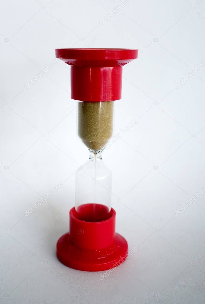 red hourglass on a white background