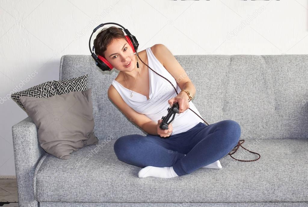girl playing with a  joystick in her hands enthusiastically
