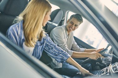 Handsome caucasian man and beautiful girl getting ready to test-