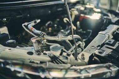 Buying a new car, engine, transmission. Business concept. Car engine in showroom close-up.