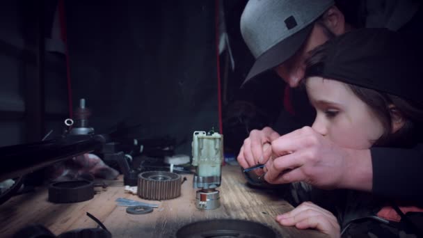 4K Dad and Son Working and Soldering Together — Stock Video
