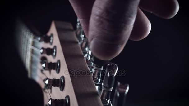 Hand Touching Tuning Pegs — Stock Video