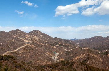 Famous Chinese Great Wall silhouette on brown hill 