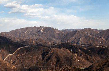 Famous Chinese Great Wall in white cloud shadows 