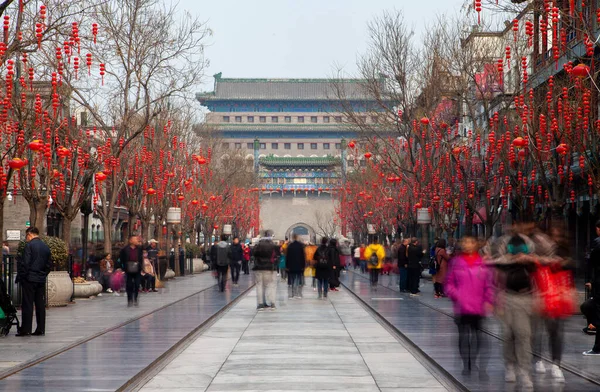 Chinese people wander along Beijing Qianmen street — Stock Fotó