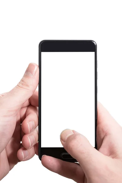 Persona masculina usando ambas manos para sostener verticalmente el teléfono inteligente con la pantalla vacía aislada en la plantilla blanca — Foto de Stock