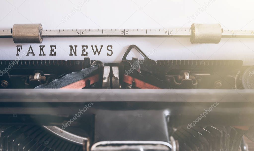 FAKE NEWS written on vintage manual typewriter