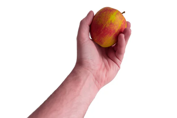 Ręka trzyma jabłko na białym tle — Zdjęcie stockowe