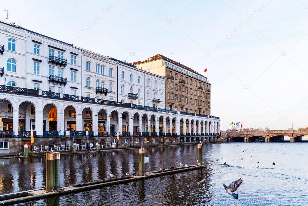 historic buildings with arcade at Alster Lake in Hamburg